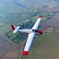 Gliding in Gloucestershire Red and White Plane Flying Over Land