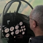 Gentleman Sitting In A Spitfire Simulator