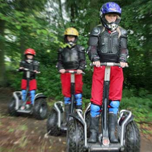 team of segway riders in woods team of segway riders in woods
